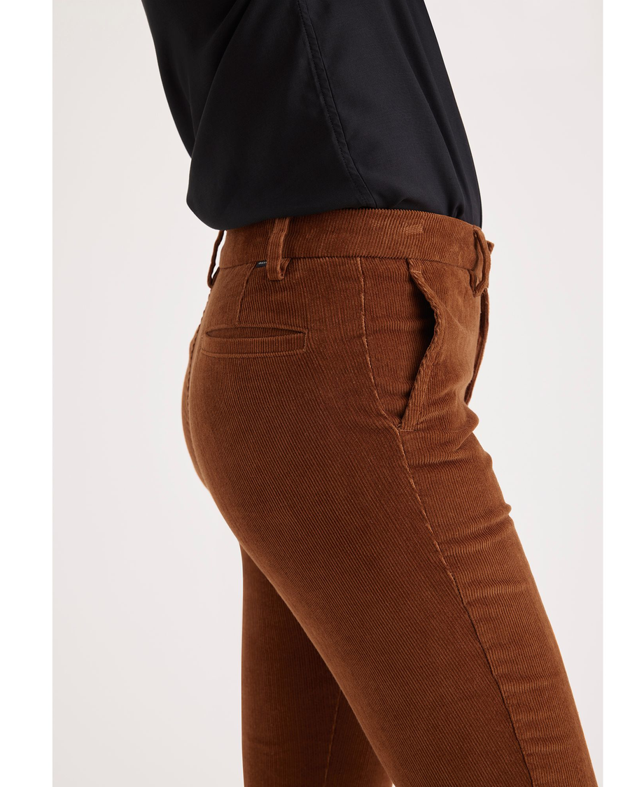 Side view of model wearing Caramel Cafe Women's Skinny Fit Chino Pants.