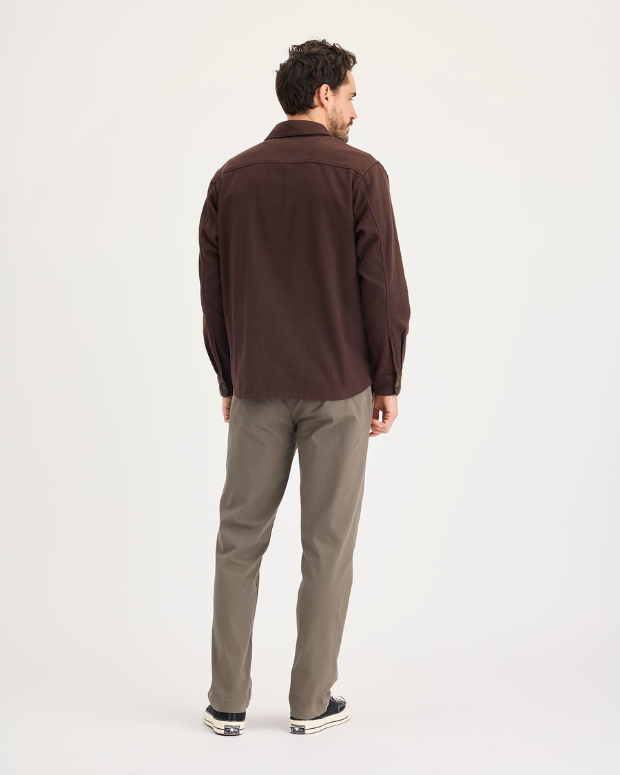 Back view of model wearing Chocolate Chip Crafted Khaki Pants, Slim Fit.