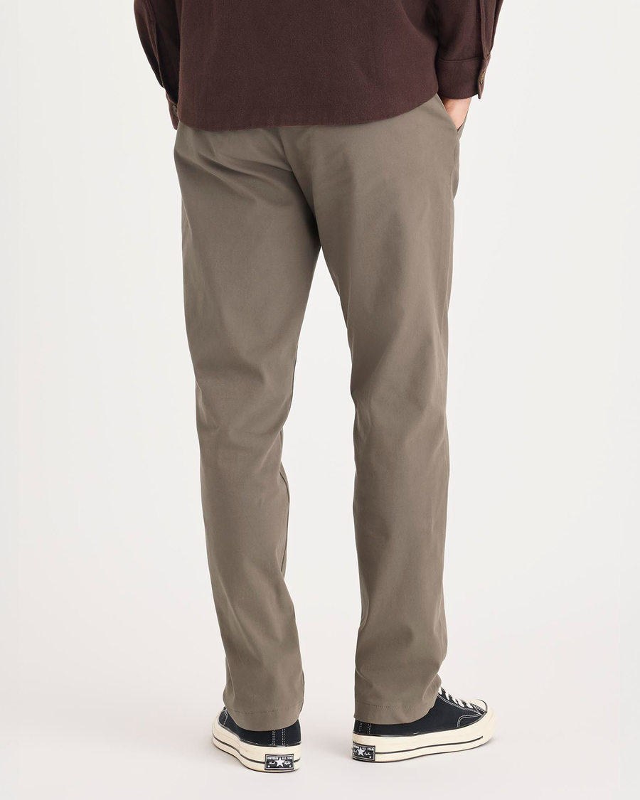 Back view of model wearing Chocolate Chip Crafted Khaki Pants, Slim Fit.