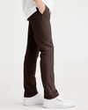 Side view of model wearing Coffee Bean Alpha Chino Pants, Skinny Fit.