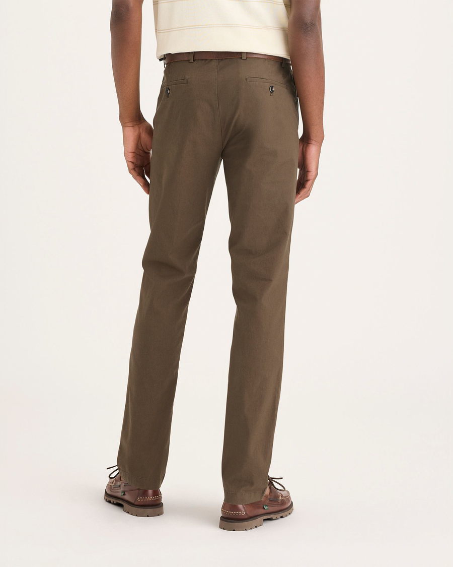 Back view of model wearing Coffee Liquer Crafted Khaki Pants, Slim Fit.