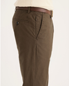 Side view of model wearing Coffee Liquer Crafted Khaki Pants, Slim Fit.