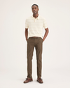 Front view of model wearing Coffee Liquer Men's Slim Fit Smart 360 Flex Alpha Chino Pants.