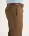 Side view of model wearing Coffee Liquer Men's Slim Fit Smart 360 Flex California Chino Pants.