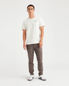 Front view of model wearing Coffee Quartz Men's Skinny Fit Original Chino Pants.