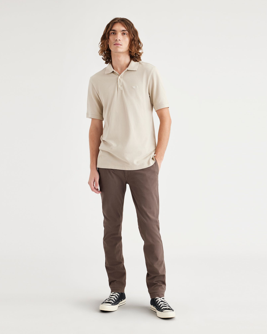 Front view of model wearing Coffee Quartz Men's Skinny Fit Smart 360 Flex California Chino Pants.