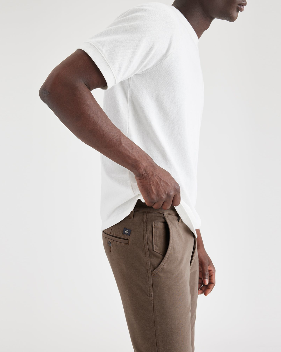 View of model wearing Coffee Quartz Men's Skinny Fit Supreme Flex Alpha Khaki Pants.