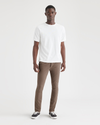 Front view of model wearing Coffee Quartz Men's Skinny Fit Supreme Flex Alpha Khaki Pants.