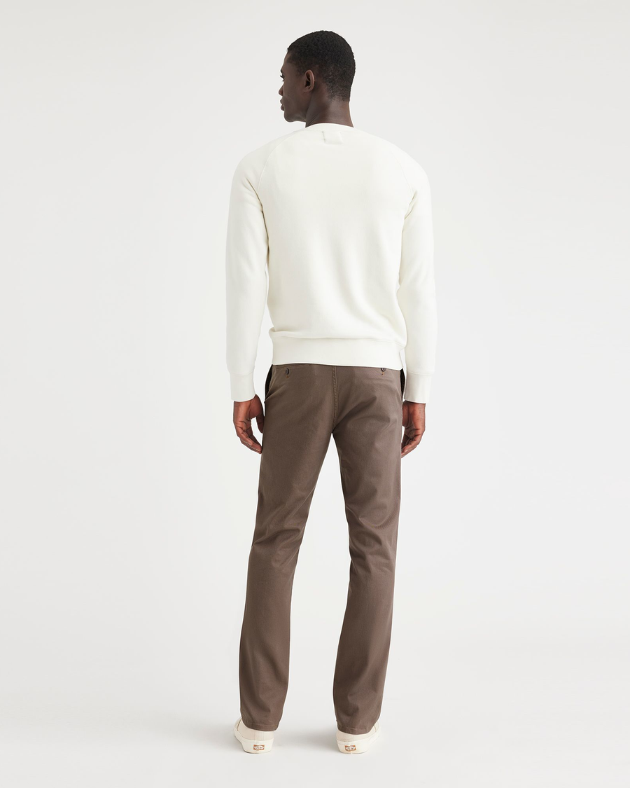 Back view of model wearing Coffee Quartz Men's Slim Fit Original Chino Pants.