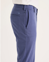 Side view of model wearing Crown Blue Chino Go Activeflex, fit skinny.