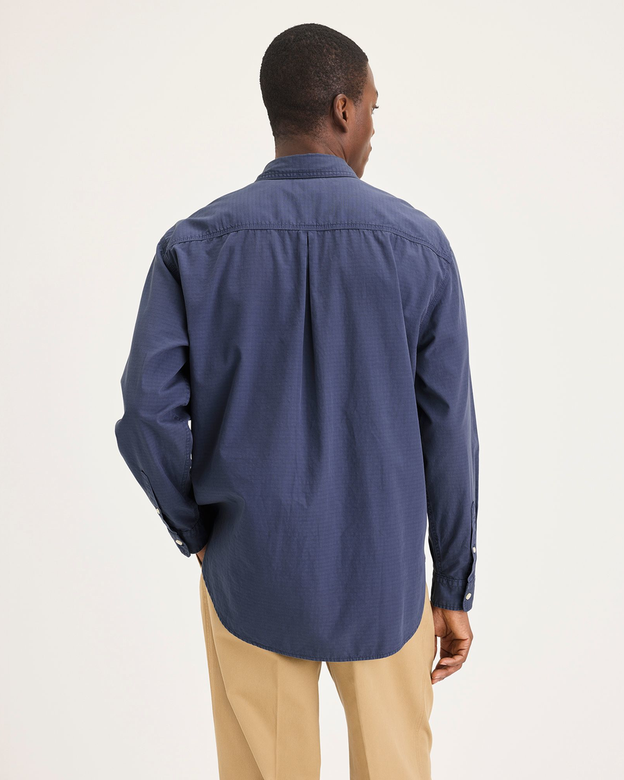 Back view of model wearing Crown Blue Men's Relaxed Fit Eighty-Six Shirt.