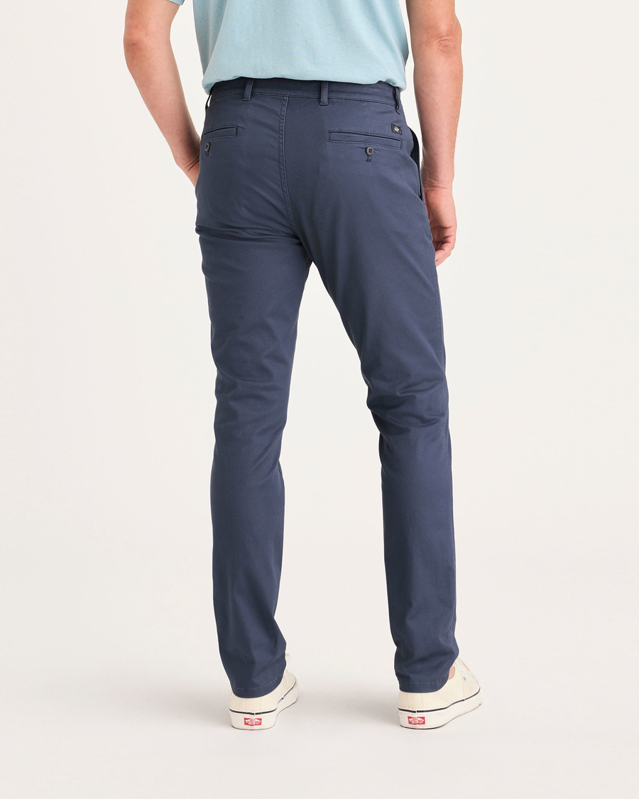 Back view of model wearing Crown Blue Men's Skinny Fit Original Chino Pants.