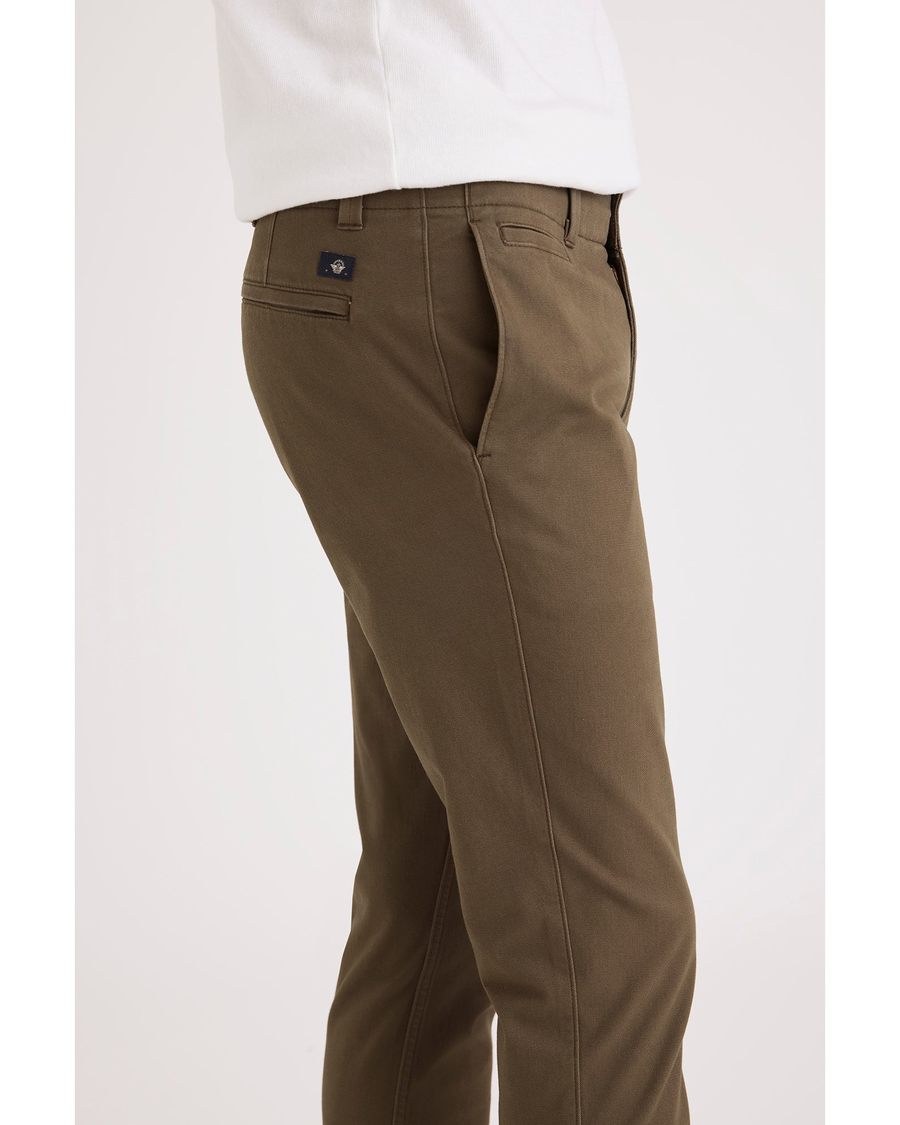 Side view of model wearing Cub Alpha Chino Pants, Skinny Fit.