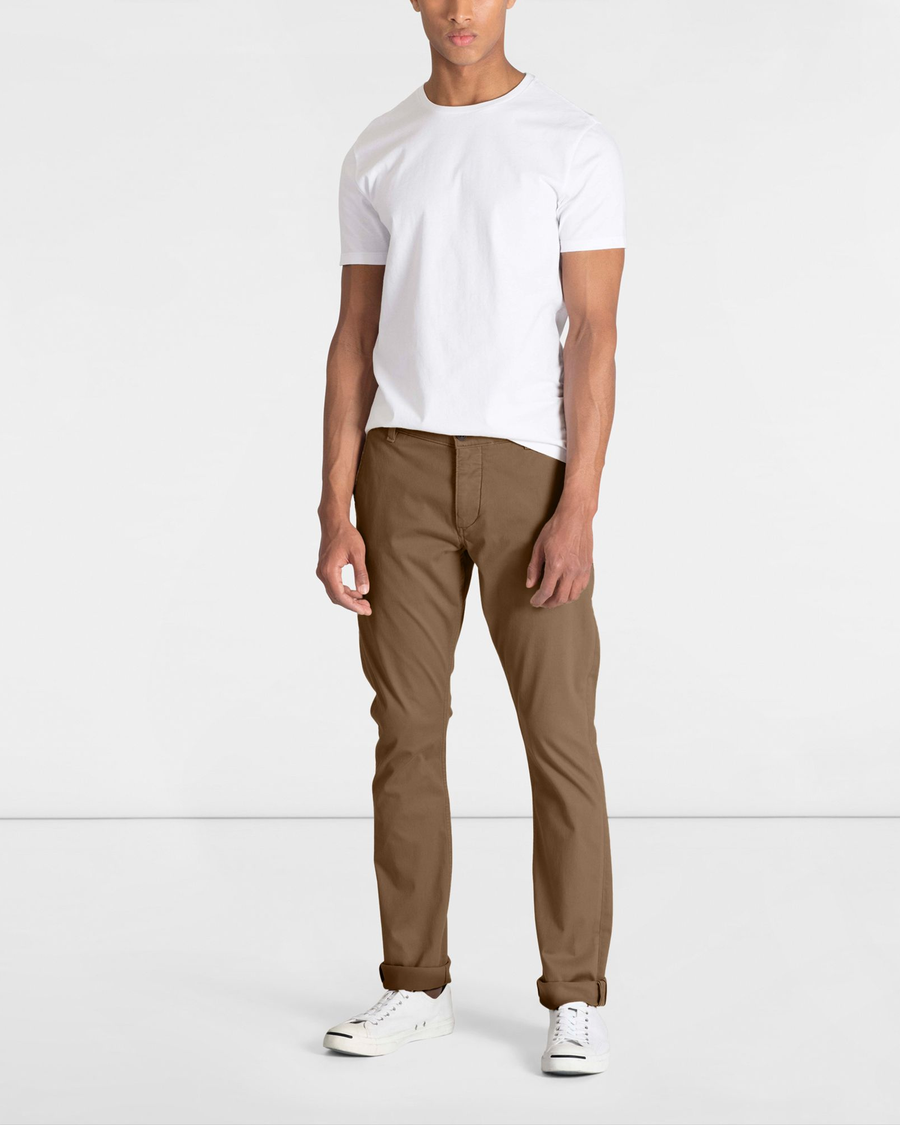 Front view of model wearing Cub Men's Skinny Fit Supreme Flex Alpha Khaki Pants.