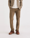 Front view of model wearing Cub Men's Slim Fit Smart 360 Flex California Chino Pants.