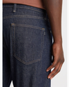 View of model wearing Dark Indigo Rinse Big and Tall Tapered Fit Original Jean Cut Pants.