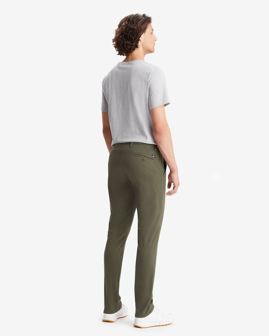 Back view of model wearing Deep Depths Men's Skinny Fit Supreme Flex Alpha Khaki Pants.
