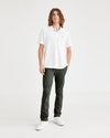 Front view of model wearing Deep Forest Men's Skinny Fit Smart 360 Flex California Chino Pants.