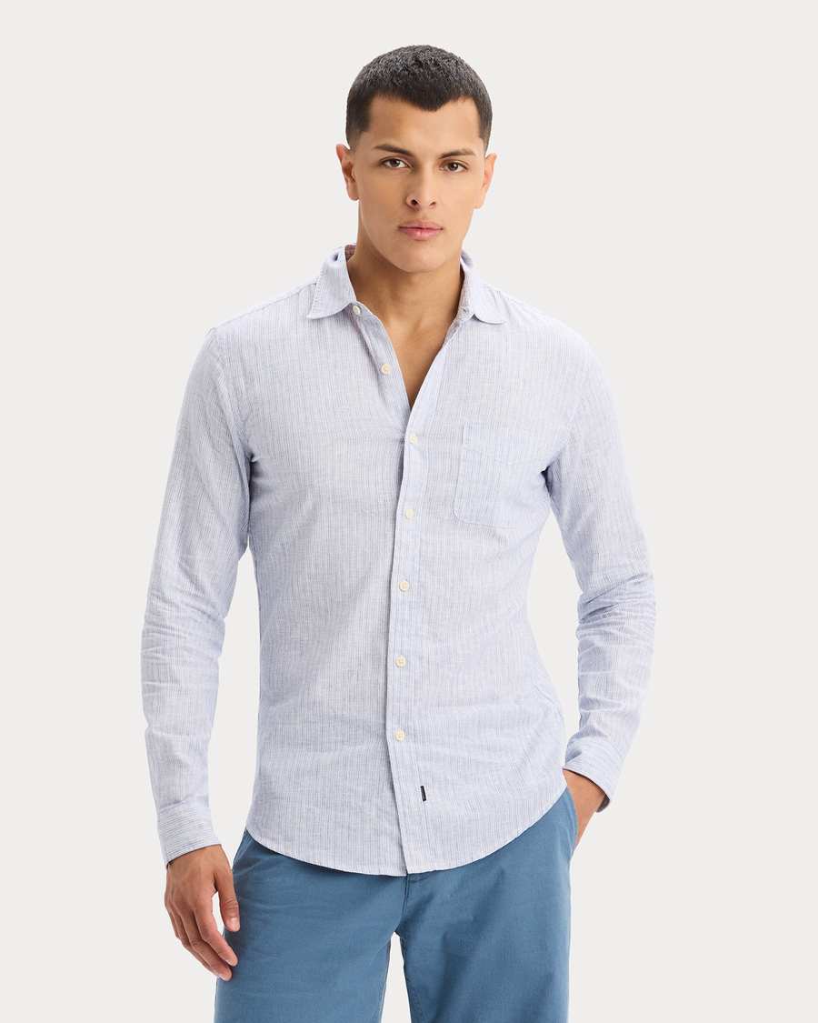 View of model wearing Deep Ultramarine Icon Button Up Shirt, Slim Fit.