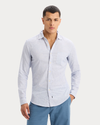 Front view of model wearing Deep Ultramarine Icon Button Up Shirt, Slim Fit.