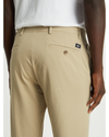 View of model wearing Dockers Khaki Men's Slim Fit Smart 360 Flex Alpha Chino Pants.