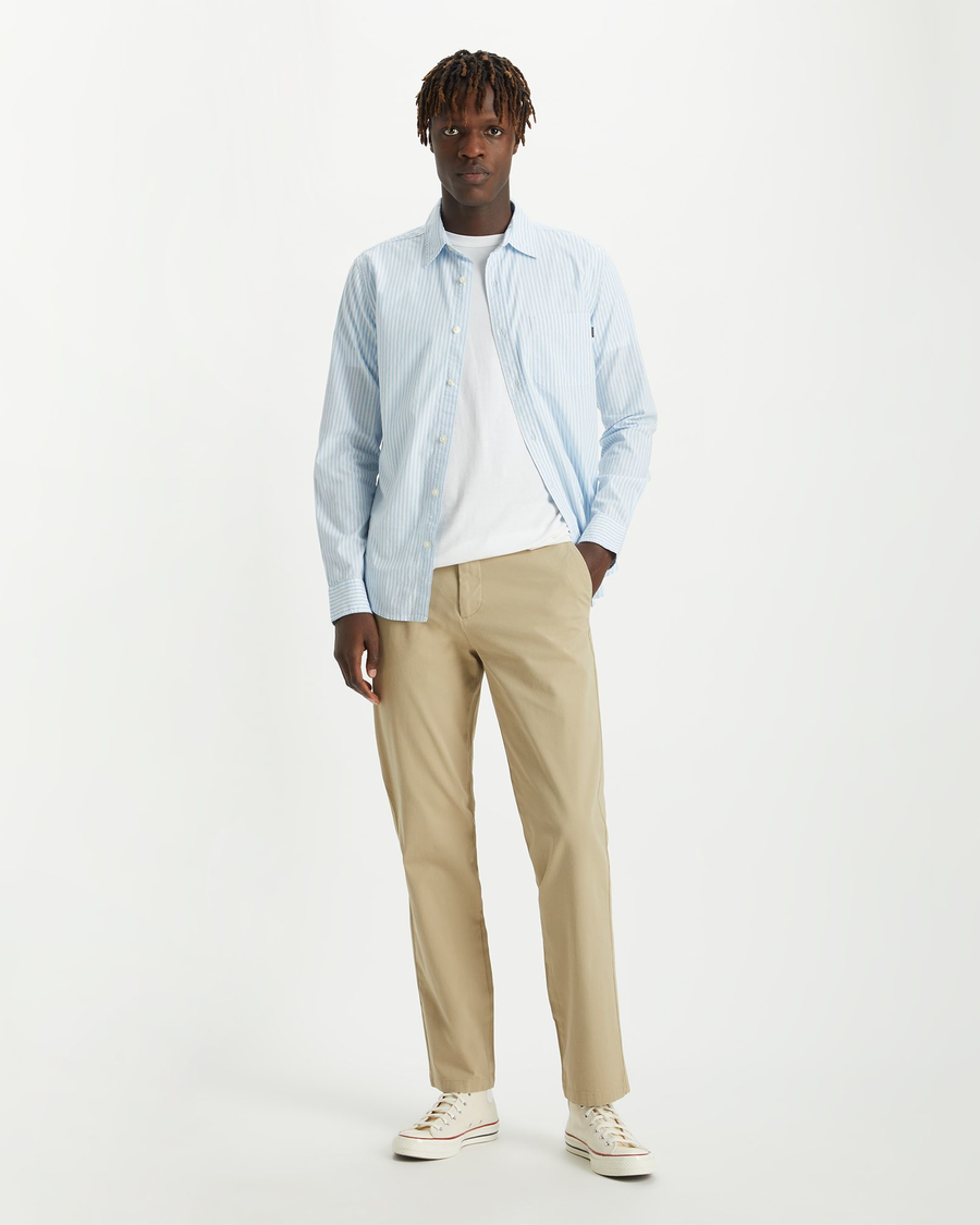 View of model wearing Dockers Khaki Men's Slim Fit Smart 360 Flex Alpha Chino Pants.