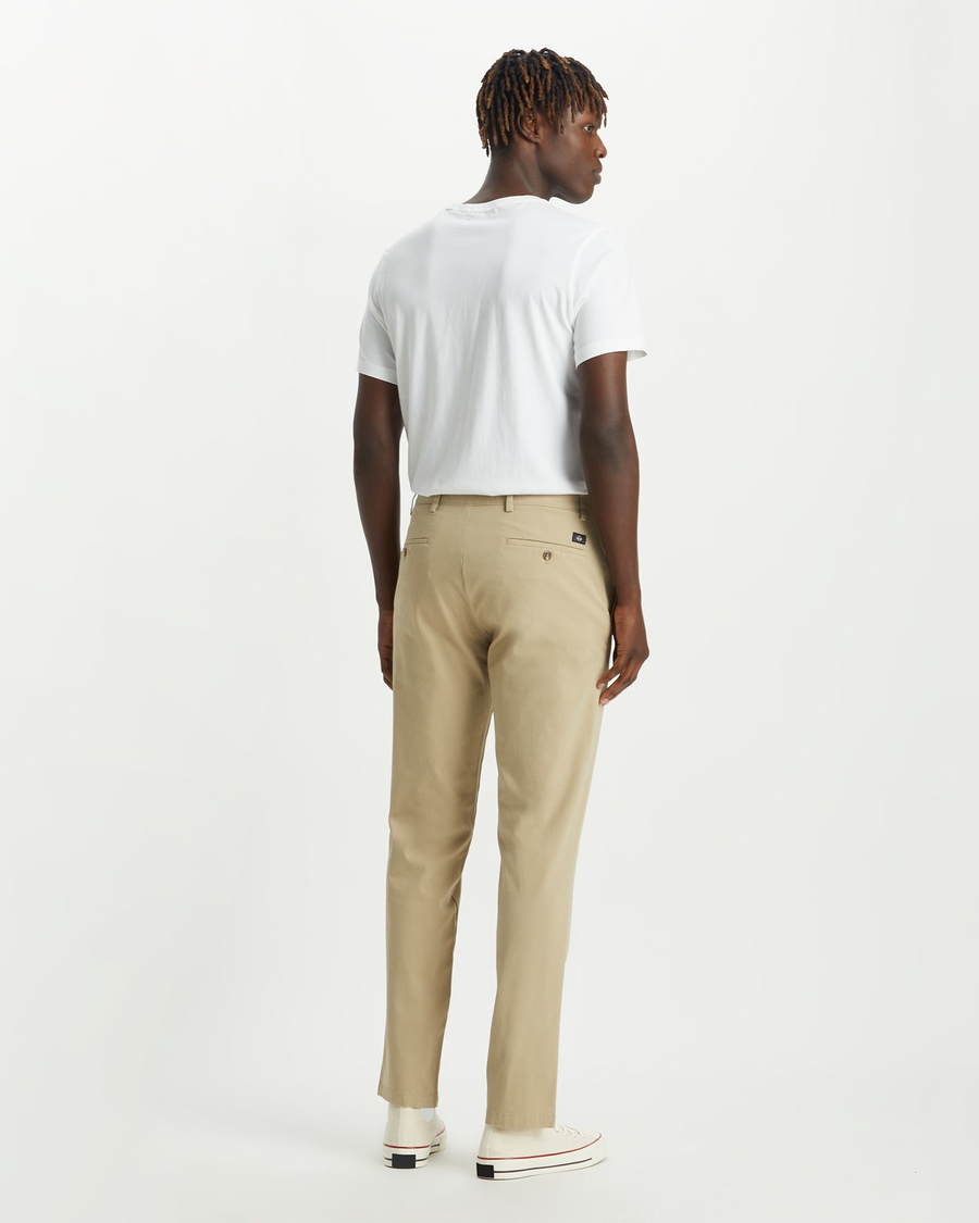 Back view of model wearing Dockers Khaki Men's Slim Fit Smart 360 Flex Alpha Chino Pants.