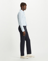 Back view of model wearing Dockers Navy Crafted Khaki Pants, Slim Fit.