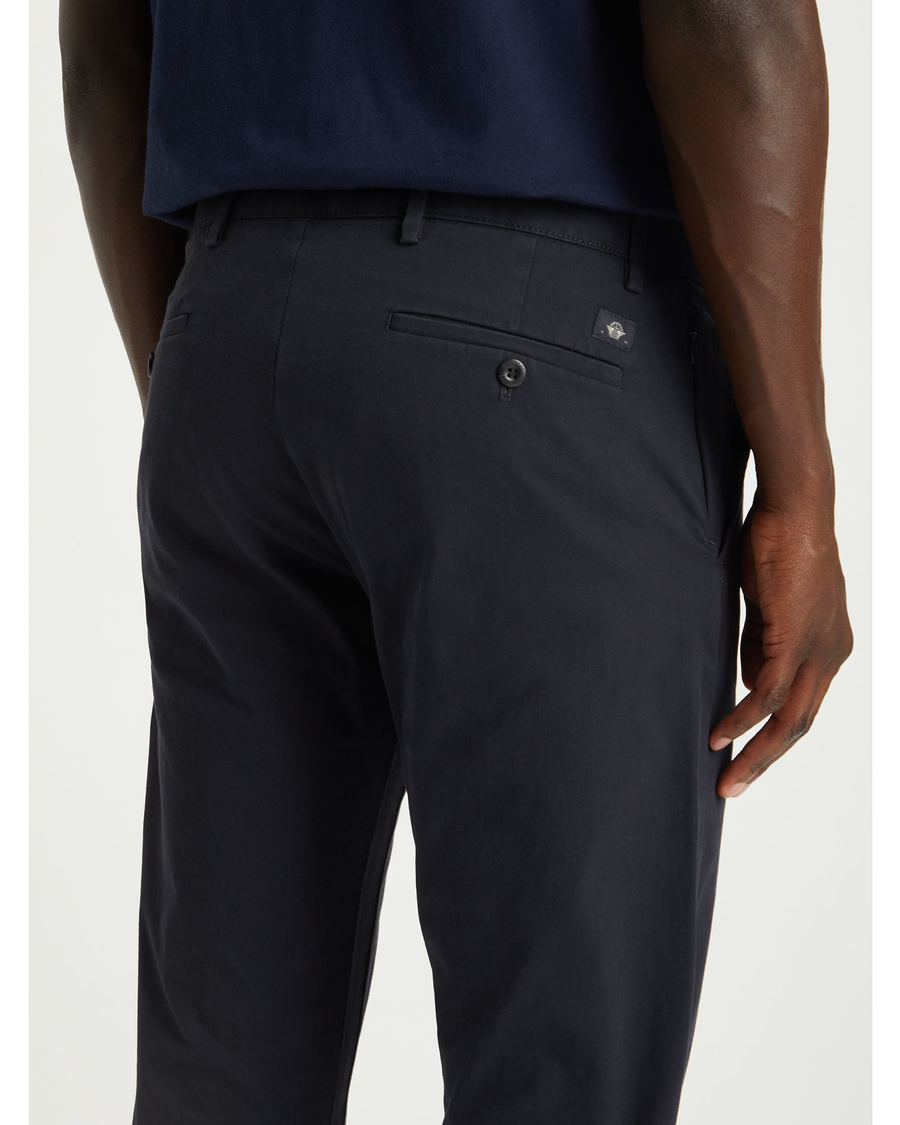 View of model wearing Dockers Navy Crafted Khaki Pants, Slim Tapered Fit.