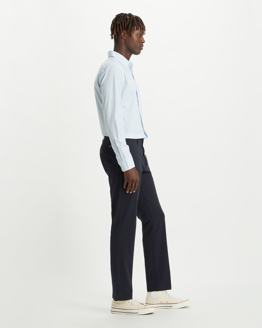 Back view of model wearing Dockers Navy Men's Slim Fit Smart 360 Flex Alpha Chino Pants.