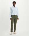 Front view of model wearing Dockers Olive Men's Skinny Fit Smart 360 Flex Alpha Khaki Pants.