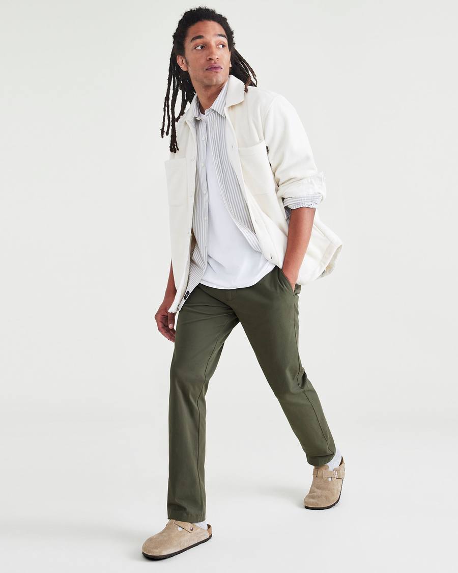 View of model wearing Dockers Olive Men's Slim Fit Smart 360 Flex Alpha Chino Pants.