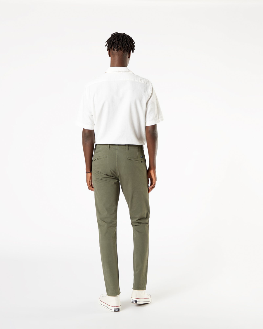 Back view of model wearing Dockers Olive Men's Slim Fit Smart 360 Flex Alpha Khaki Pants.