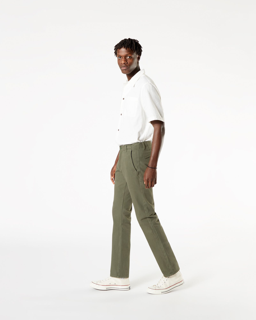Side view of model wearing Dockers Olive Men's Slim Fit Smart 360 Flex Alpha Khaki Pants.