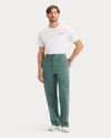 View of model wearing Duck Green Eighty-Six Original Chino Pants, Loose Fit.