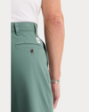 View of model wearing Duck Green Eighty-Six Original Chino Pants, Loose Fit.