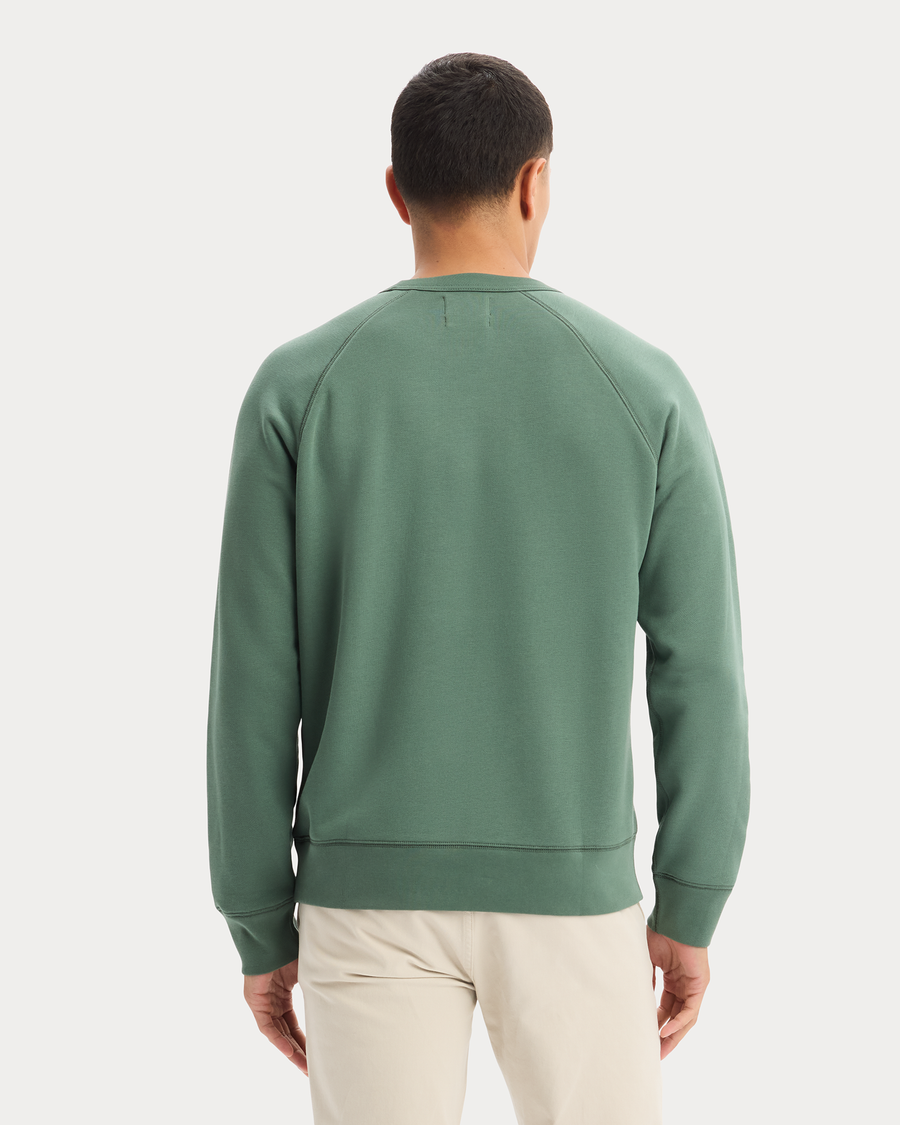 View of model wearing Duck Green Icon Crewneck Sweatshirt, Regular Fit.