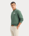 View of model wearing Duck Green Icon Crewneck Sweatshirt, Regular Fit.