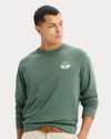 View of model wearing Duck Green Icon Crewneck Sweatshirt, Regular Fit.
