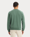 Back view of model wearing Duck Green Icon Crewneck Sweatshirt, Regular Fit.