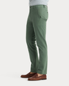 Side view of model wearing Duck Green Ultimate Chinos, Slim Fit.