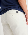 View of model wearing Egret Men's Slim Fit Original Chino Pants.