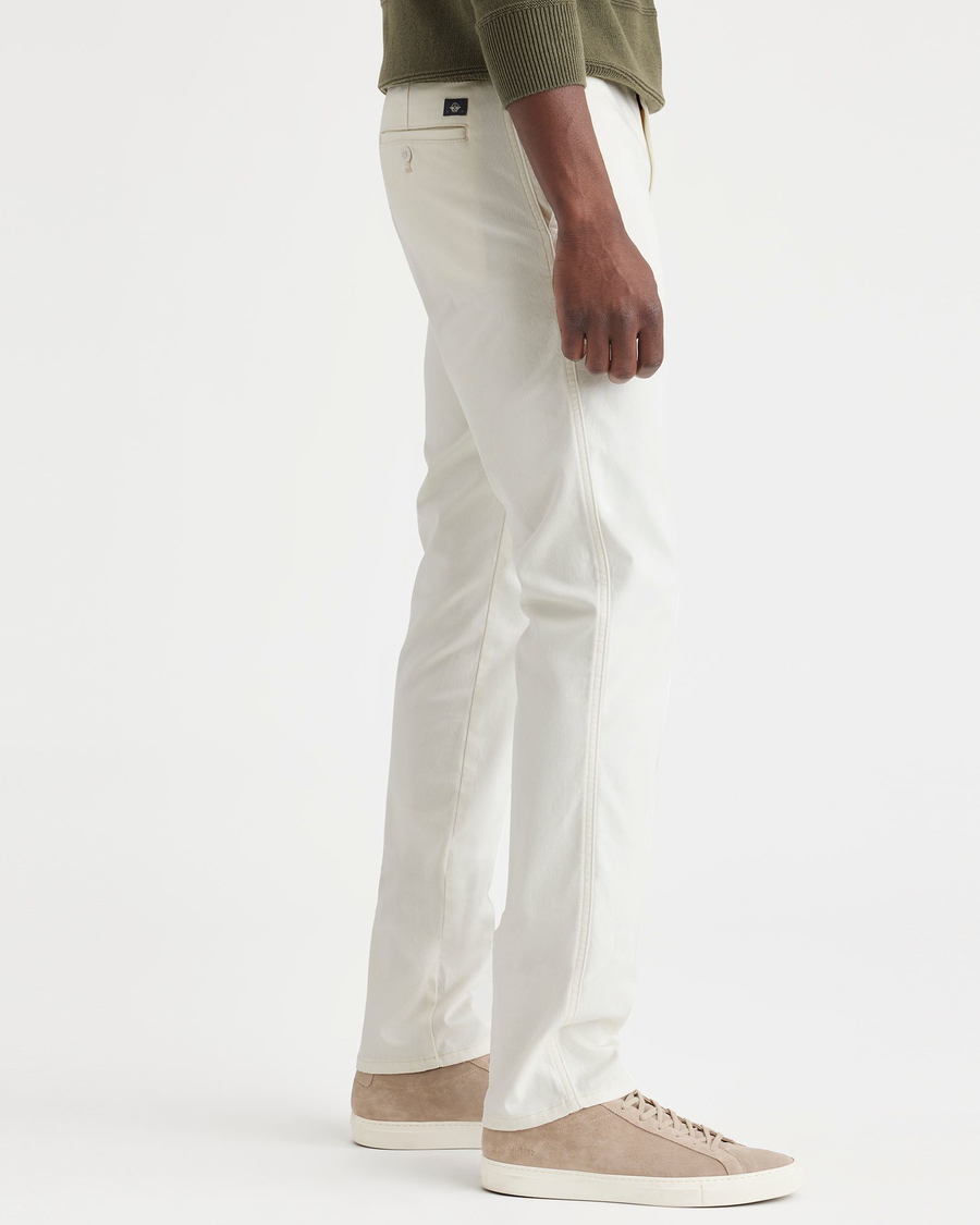 Side view of model wearing Egret Men's Slim Fit Original Chino Pants.