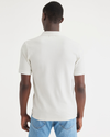 Back view of model wearing Egret Men's Slim Fit Original Polo Shirt.