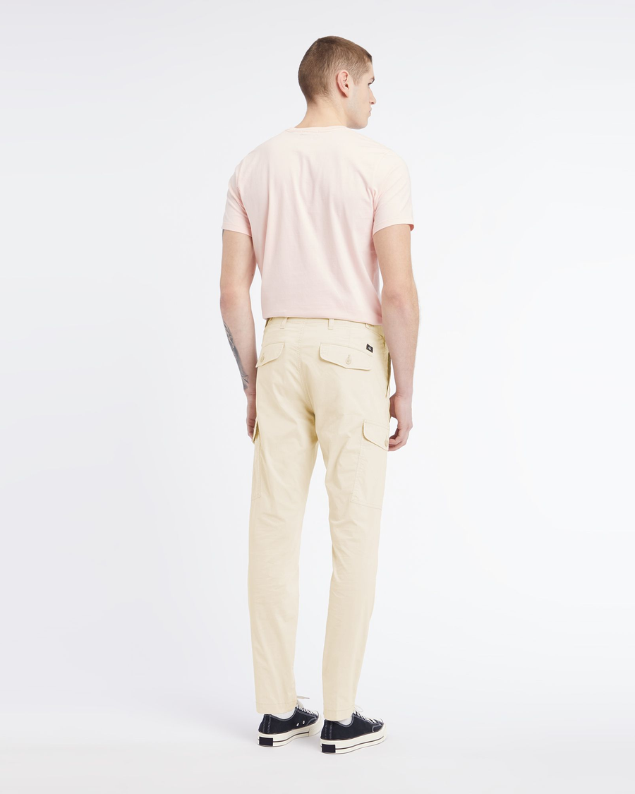 Back view of model wearing Egret Men's Slim Tapered Fit Cargo Pants.