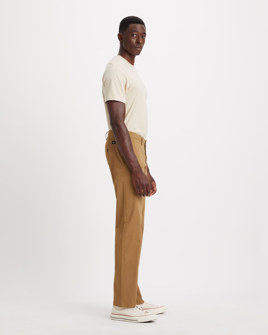 Side view of model wearing Ermine Men's Straight Fit Smart 360 Flex Alpha Chino Pants.