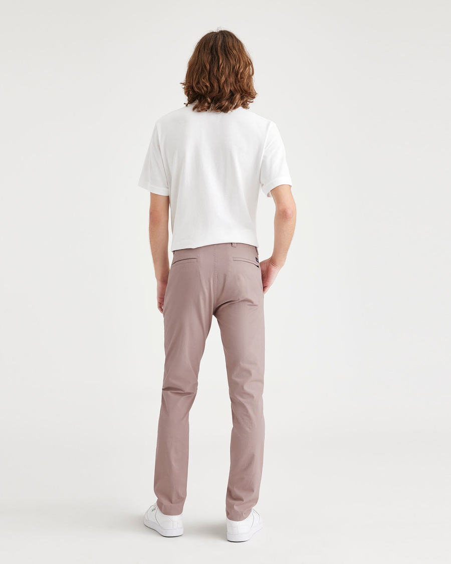 Back view of model wearing Fawn Men's Skinny Fit Smart 360 Flex California Chino Pants.