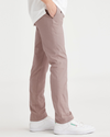 Side view of model wearing Fawn Men's Skinny Fit Smart 360 Flex California Chino Pants.
