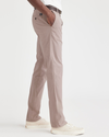 Side view of model wearing Fawn Men's Slim Fit Original Chino Pants.