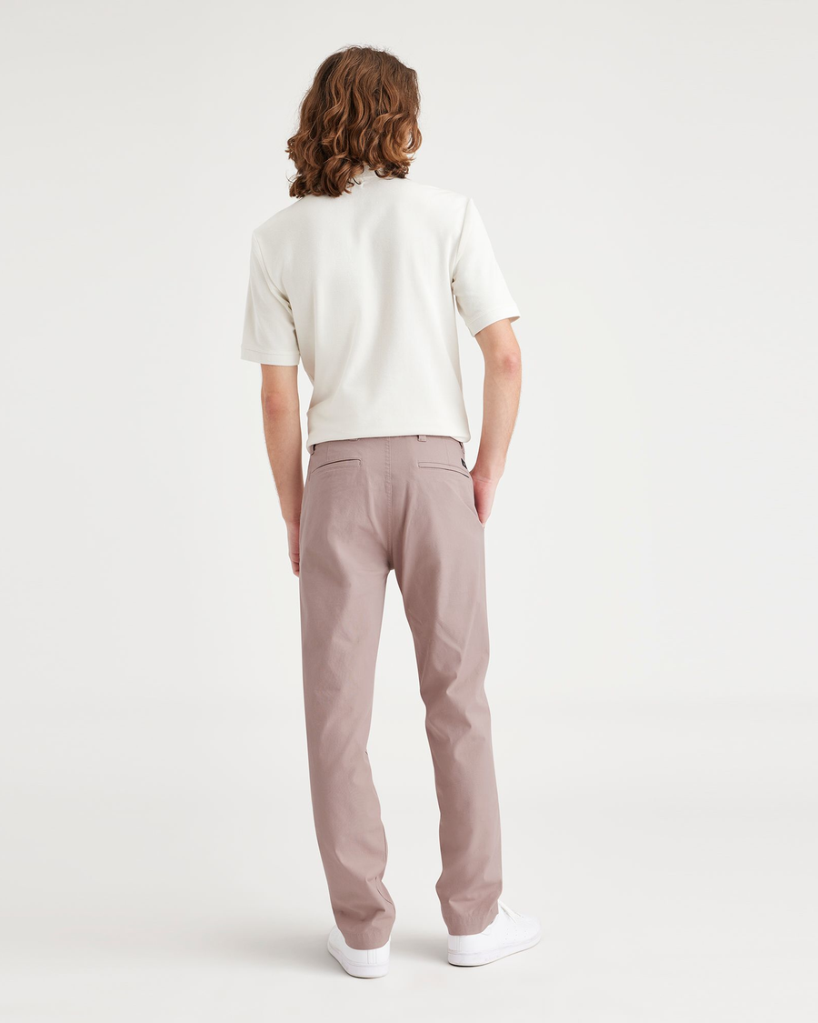 Back view of model wearing Fawn Men's Slim Fit Smart 360 Flex California Chino Pants.